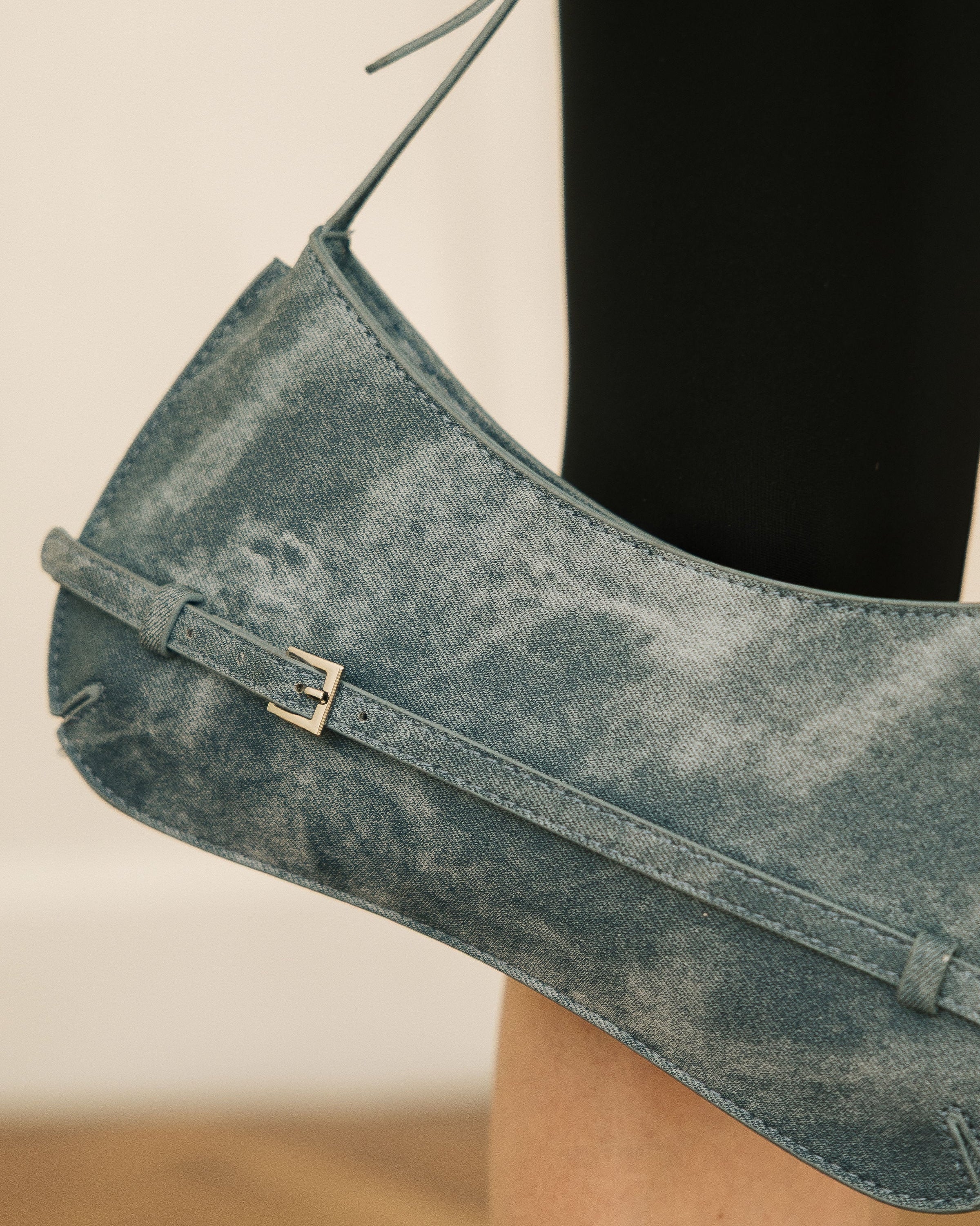 Denim Effect Baguette Bag worn by model in blue shirt and black leggings