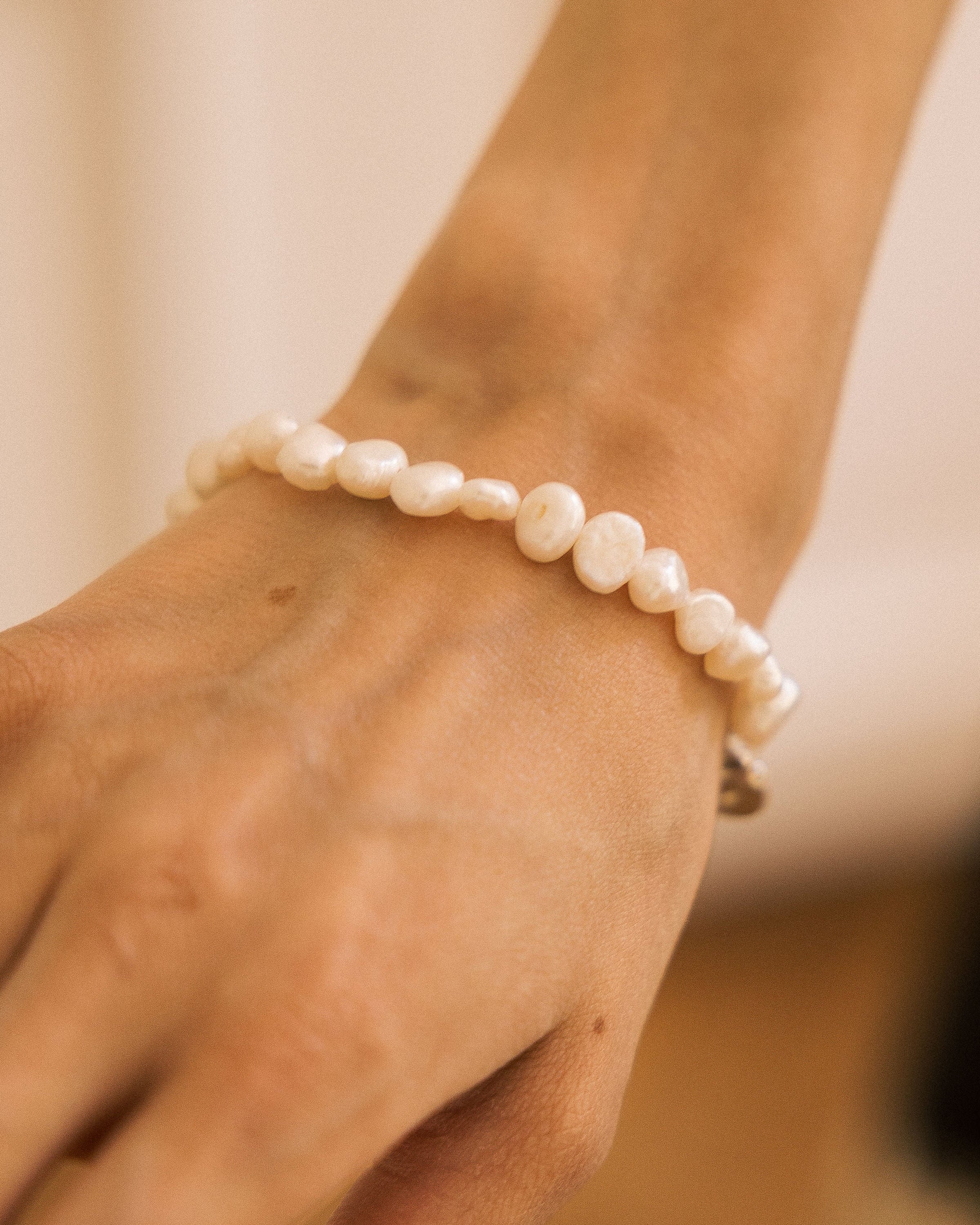 Freshwater Pearl Bracelet worn on wrist against black lace skirt