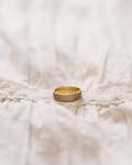 Pavé ring gold-plated with rhinestones on white lace fabric