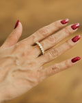 Silver stone band ring with sparkling stones on hand