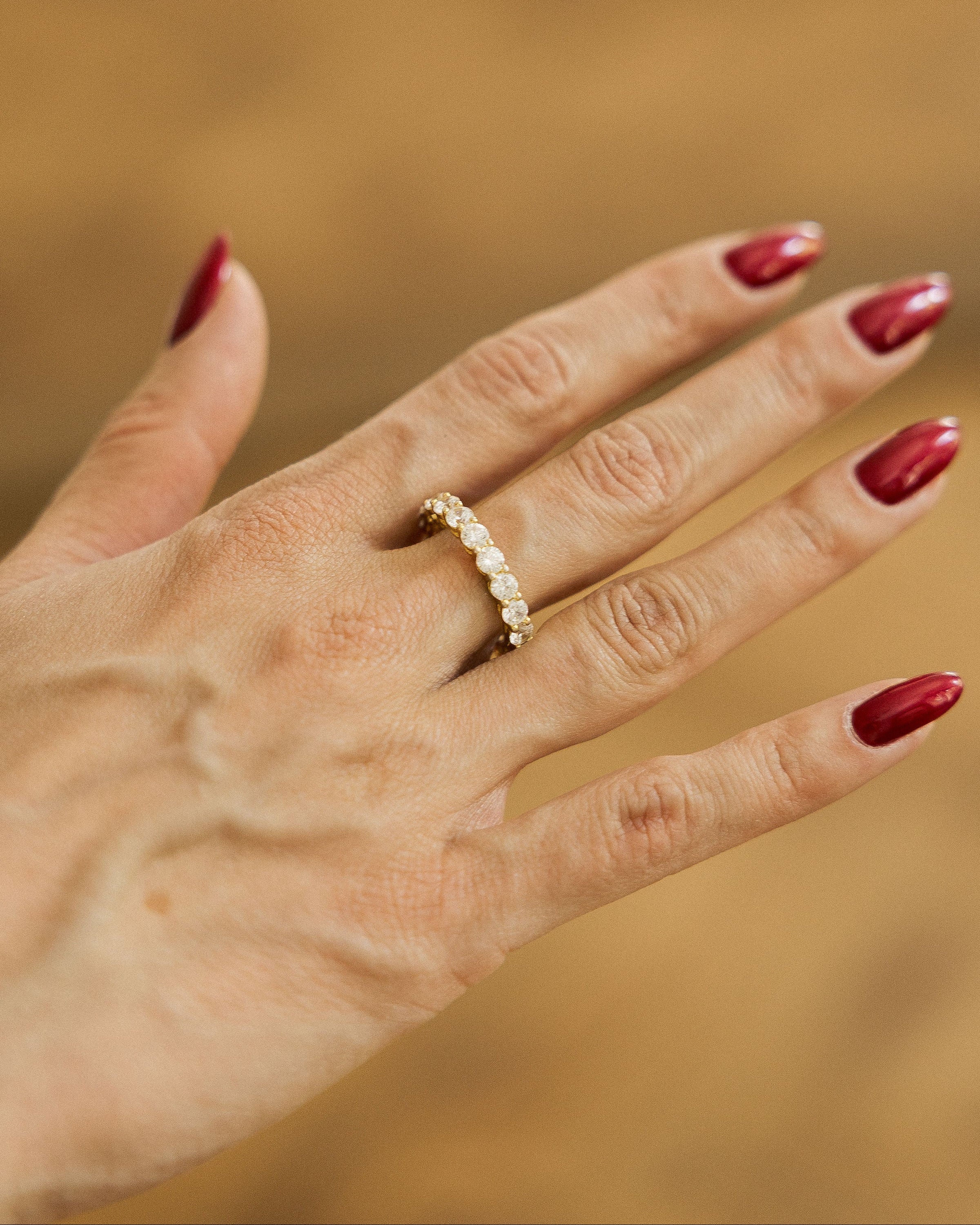 Silver stone band ring with sparkling stones on hand