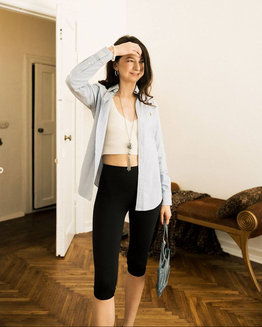 Statement Knot Tassel Necklace worn by model in blue shirt and white crop top full body