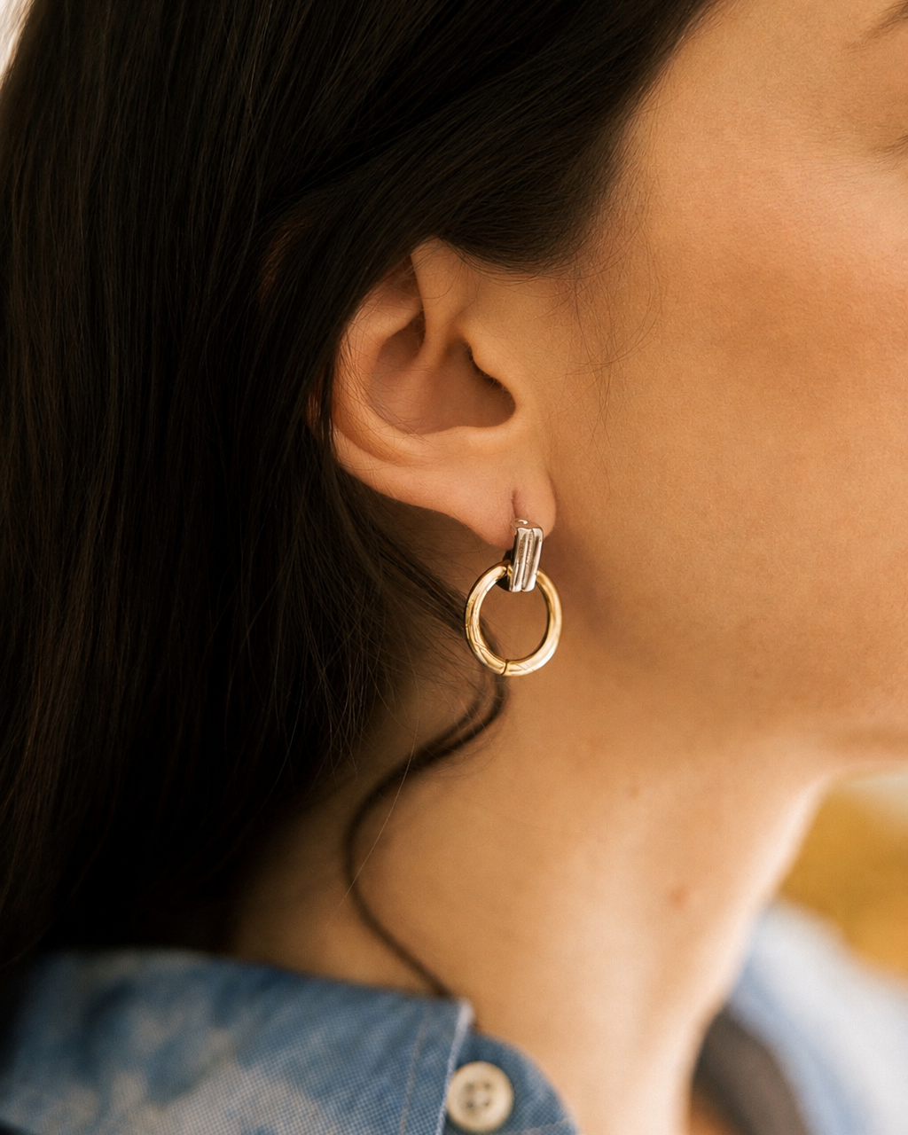 Two-Tone Hoop Earrings pair on vintage ivory rotary telephone