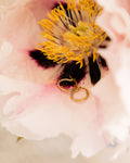 Two-Tone Mini Hoop Earrings nestled in pink peony flower showing gold and silver texture