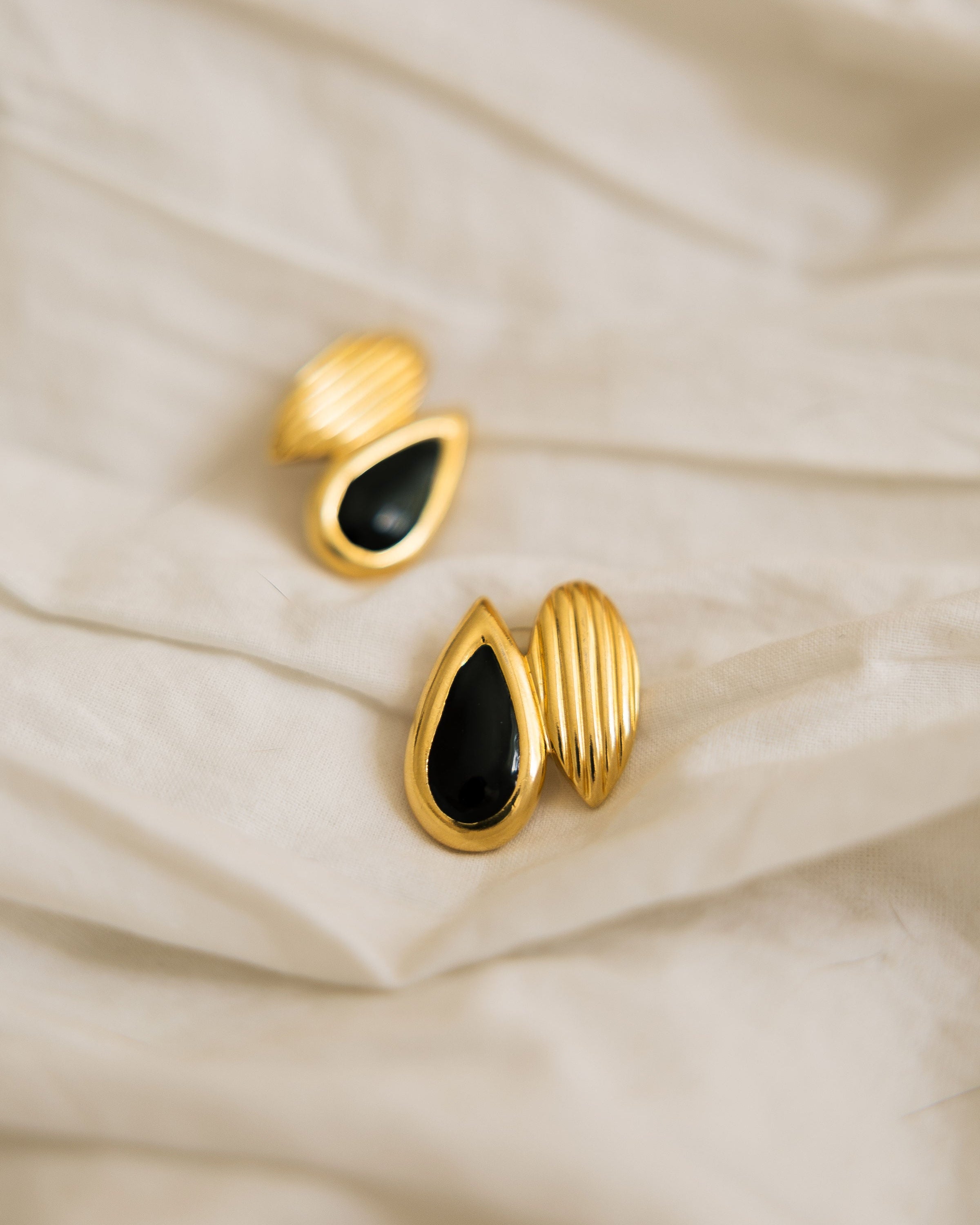 Vintage Black and Gold Statement Earrings pair flat lay