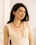 Vintage Honey Toned Necklace worn on model in white lace top